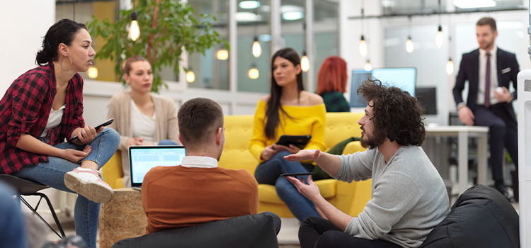Students gathered in a lounge area talk