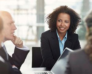 woman leads business team in meeting