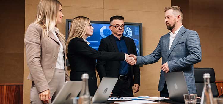 business leaders shake hands after a productive meeting