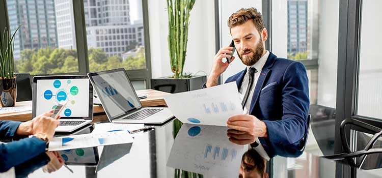 marketing manager on call with client reviewing data on recent product sales